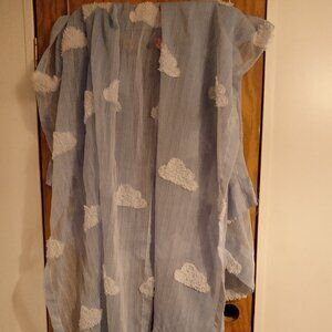 Cute cloud curtains for a child's room.